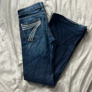7 for all Mankind designer jeans. Medium-dark wash. “7” detailing on pockets.